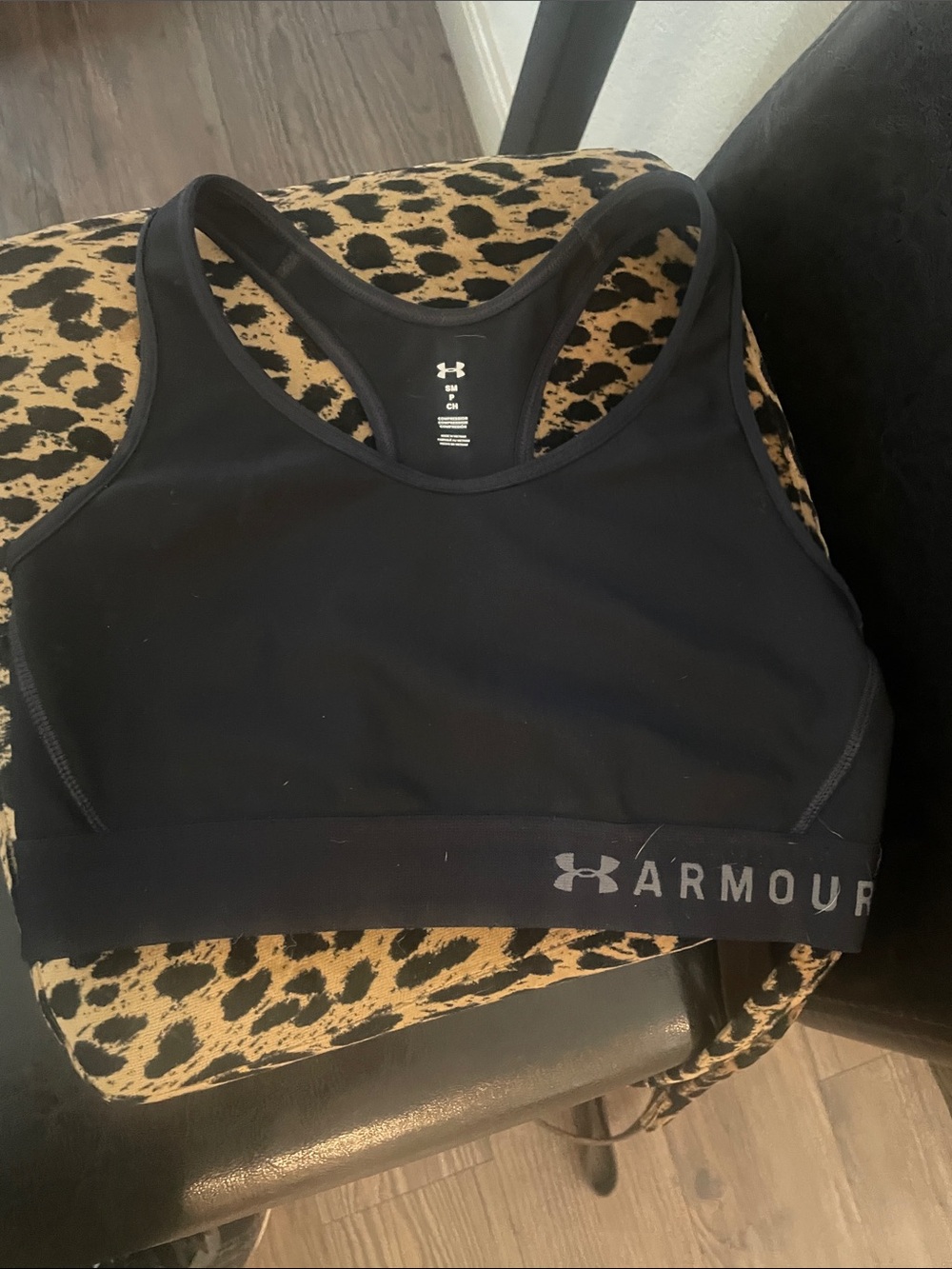 Under Armour Black eyehole back Sports Crop Bra with Logo Band